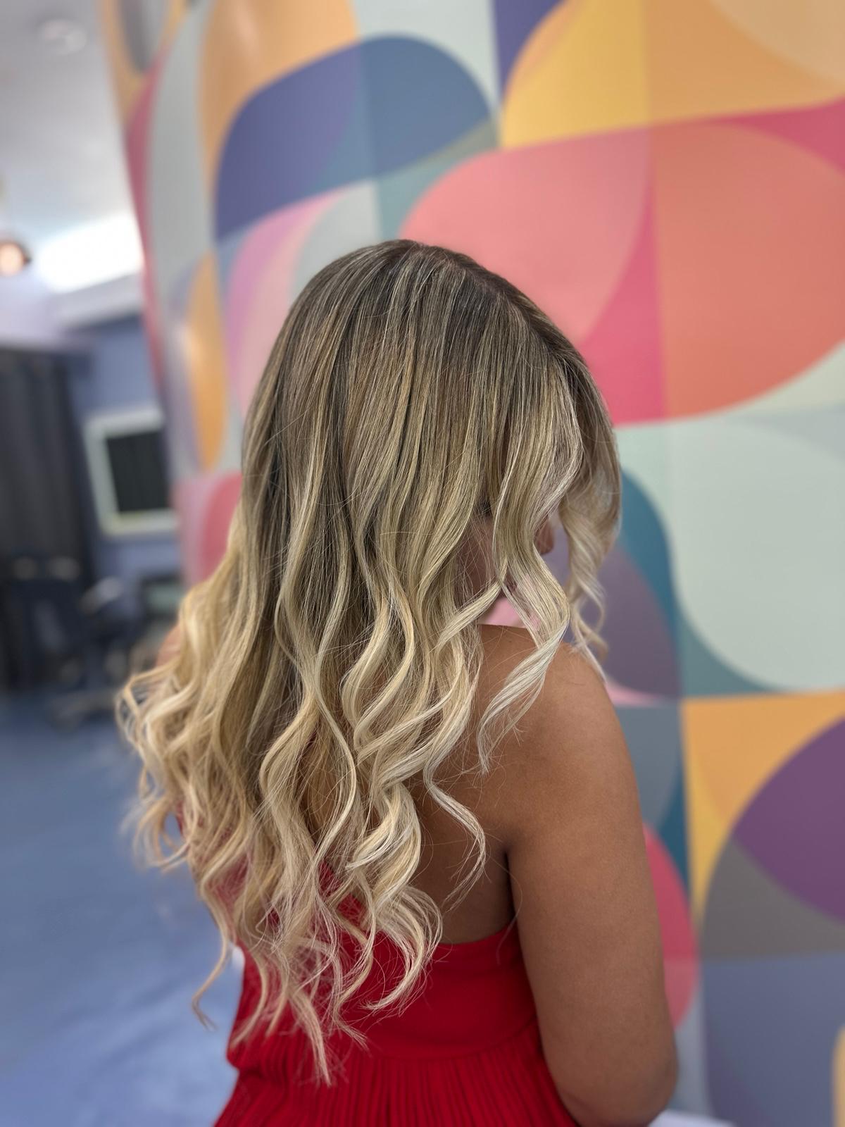 After: blonde balayage with soft waves, color correction by Yexsabell at Beyond Salon in Condado, San Juan