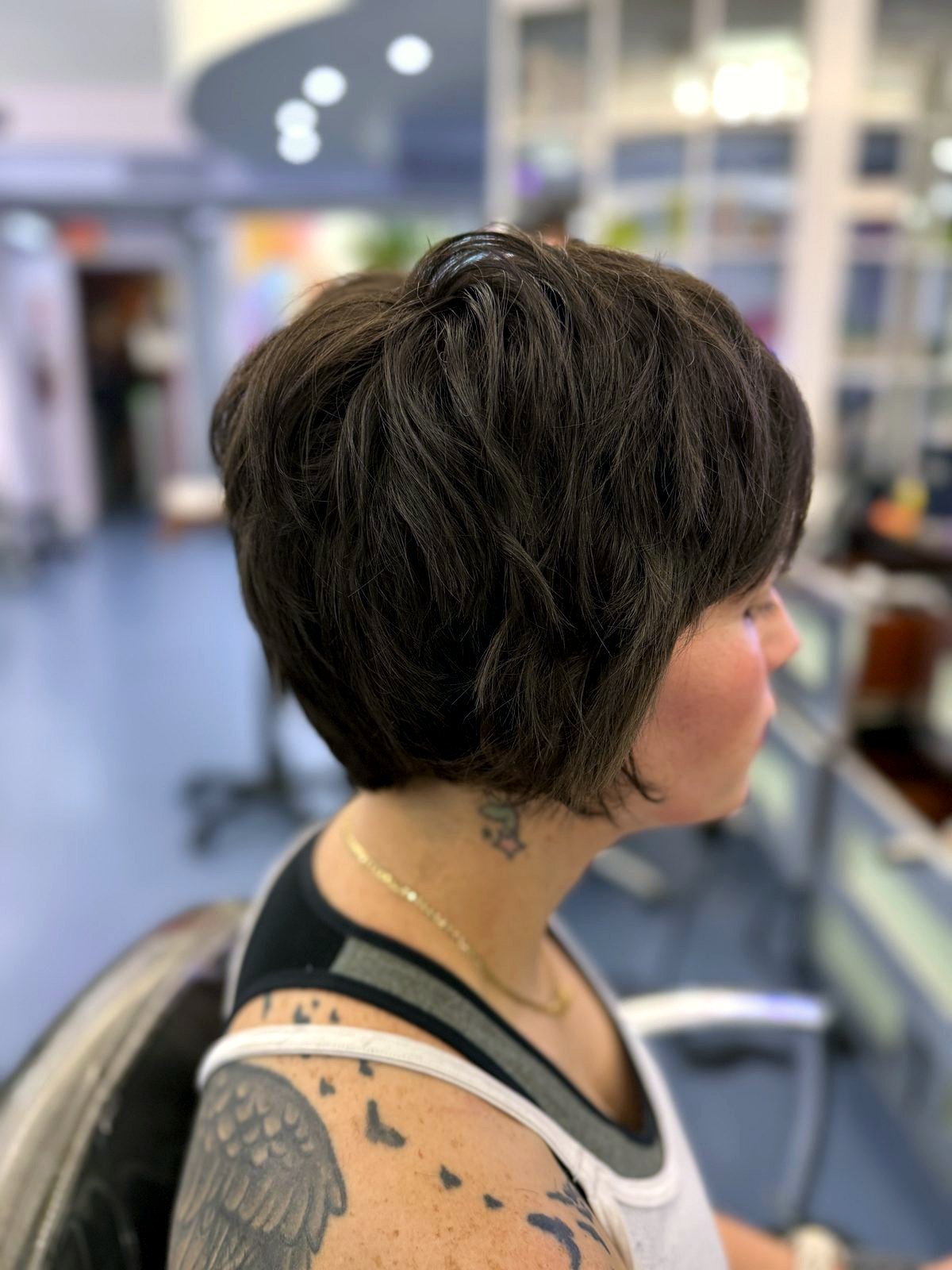 Textured dark pixie cut, back view, Beyond Salon Condado San Juan